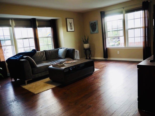 Living room with plenty of lights. - 155 Kensington Dr