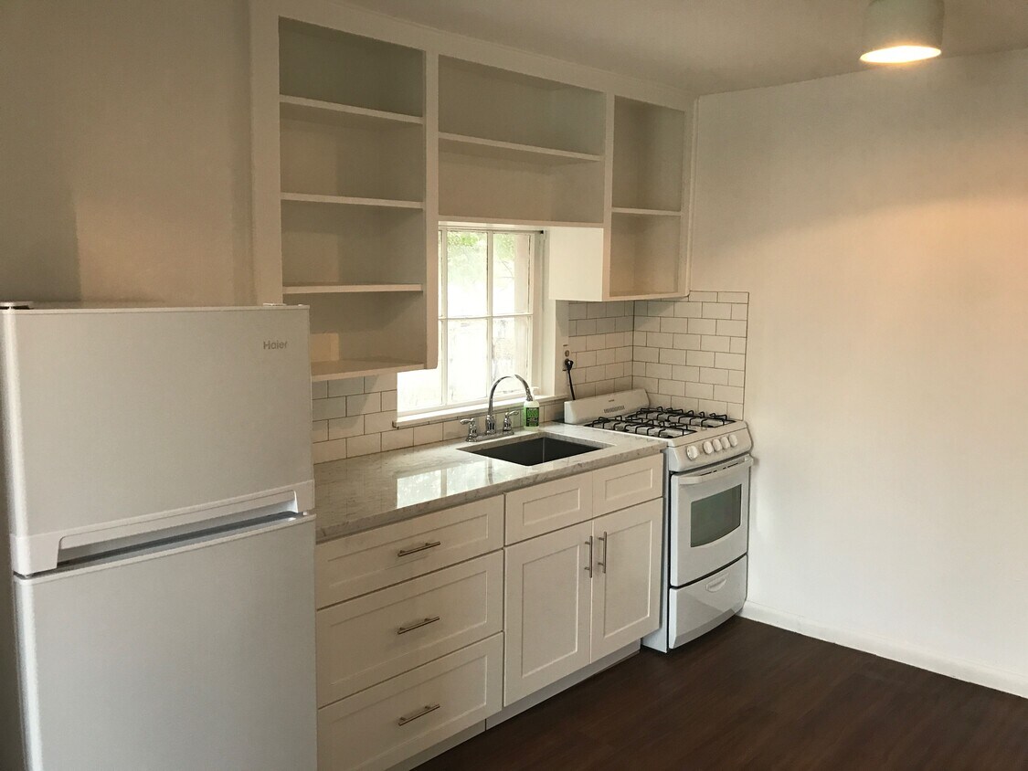 Kitchen: gas stove, carrera marble counters, - 1807 Garden St