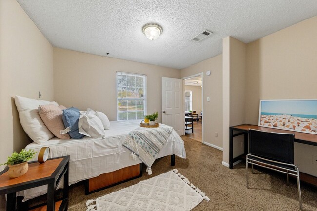 Spacious Bedroom with Desk and Study Space - Theater Street Apartments