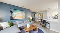 Located in Orlando, FL, this thoughtfully designed 1-bedroom, 2-bathroom home offers a cohesive, modern aesthetic across a single, well-organized floor. The open-concept living, dining, and kitchen area serves as the heart of the home, highlighted by a bold slate-blue accent wall that anchors the space. Light wood-style flooring flows throughout, complementing the bright, airy atmosphere created by multiple windows that invite natural light. The living area offers generous room for comfortable seating and entertainment, while a dedicated dining nook — framed by the same signature blue wall and a large floor mirror — provides an intimate setting for meals. The kitchen features white cabinetry, white countertops, and stainless steel appliances, with a window overlooking the outdoors adding to its bright, functional character. A breakfast bar connects the kitchen seamlessly to the main living area. The spacious primary bedroom is a serene retreat, distinguished by a sage green accent wall, dual windows, a ceiling fan, and direct access to an en-suite bathroom. A dedicated laundry area with a full-size washer and dryer adds everyday convenience. Two bathrooms, a hallway, and a closet complete this well-appointed home, making it an ideal blend of style and practicality.