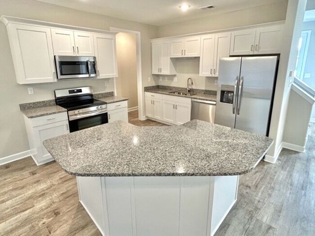 Building Photo - Now Leasing a in Millington @ Windstone Es...