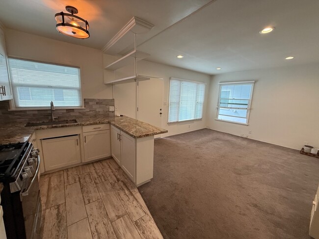 Open Kitchen to Living Room with Granite Breakfast Bar - 811 S Catalina Ave