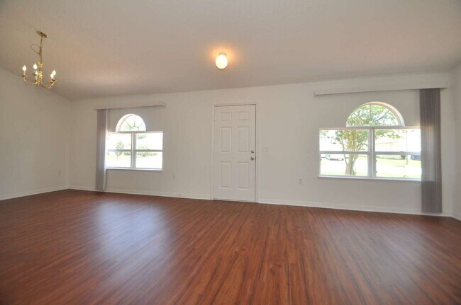 Building Photo - "Spacious 4-Bed Oasis in Palm Coast – Your...