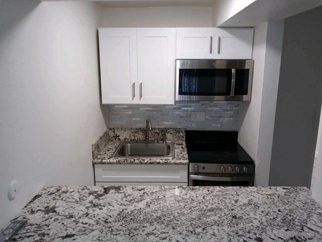 Granite countertops stainless steel appliances - 3360 W Lincoln Ave