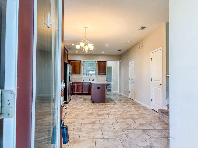 Building Photo - Spacious 4-Bedroom Townhome in Harmony – A Perfect Blend of Nature & Comfort!