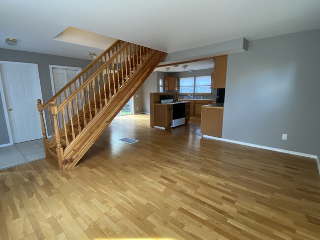 Open concept living room leads to kitchen - 680 Discovery Rd