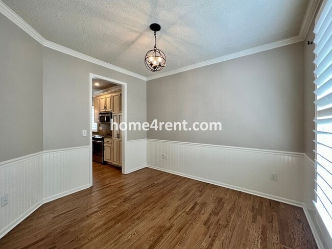 Building Photo - Updated Kitchen, Large Two Tiered Deck, Finished Basement in Blue Valley Schools!