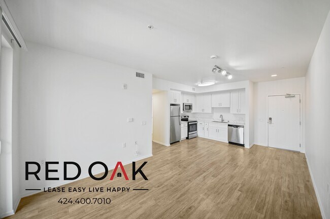 Building Photo - ~1 Month FREE~ Sunlit and Inviting Two Bed...