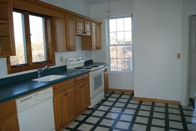 Kitchen has recently been updated with stainless steel appliances, new cabinets, and new flooring. - 43 Prospect Ave