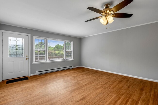 Building Photo - Updated Home, Stainless Steel Appliances, Wood Like Flooring, Deck, Garage!
