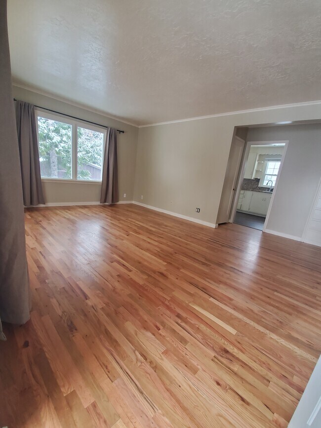 Refinished original red oak flooring in LR & BRs - 1438 Cahoon St
