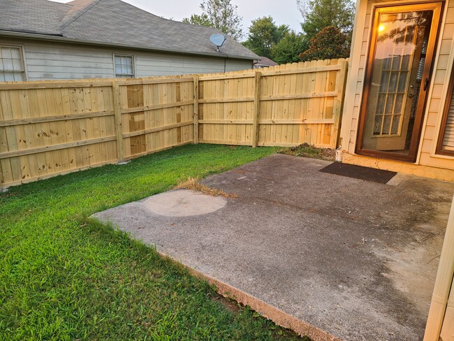 Patio with brand new privacy fence - 104 Bridgestone Dr NE