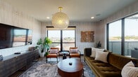 Located at Westley Lookout in Kansas City, Missouri, this thoughtfully designed single-floor amenity space combines modern aesthetics with functional comfort. The interior lounge serves as the centerpiece, featuring textured vertical-striped wall paneling, warm hardwood-style flooring, and a striking honeycomb-patterned globe pendant light suspended from the ceiling. Seating arrangements include a plush olive-green sofa paired with cognac leather accent chairs gathered around a rounded wood coffee table, creating an inviting and well-appointed gathering area. Large black-framed windows flood the space with natural light while offering elevated views of the Kansas City skyline and surrounding neighborhood streetscape. A wall-mounted television and a media console with stacked books add to the functional yet curated aesthetic, complemented by lush tropical houseplants throughout.

An adjacent kitchenette area provides practical amenities, featuring dark cabinetry, a black undermount sink with a matte black faucet, dark countertops, and large-format tile accents on the wall behind the counter. The space transitions seamlessly to an outdoor terrace, defined by exposed brick walls and an ornate geometric metal pergola overhead. The terrace is equipped with a gas grill, outdoor dining table and chairs, and a wall-mounted television, making it ideal for entertaining while enjoying open-air Kansas City views.