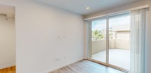 This contemporary 570 square foot apartment in Murrieta, CA offers a thoughtfully designed living space. The single-floor layout comprises one bedroom (140 sq ft), one bathroom, a kitchen, and a closet. The interior is characterized by its bright, airy ambiance, achieved through white walls and ample natural light from windows.

The kitchen is a standout feature, boasting sleek wood-grain cabinetry, stainless steel appliances, and a convenient island. The subway tile backsplash and light-colored countertops contribute to the modern aesthetic. The open-concept design seamlessly integrates the kitchen with the living area, enhancing the sense of space.

The bathroom continues the contemporary theme with a wood-grain vanity, large mirror, and a combination tub-shower. A built-in wall niche provides practical storage. Throughout the apartment, wood-look flooring adds warmth and durability.

The bedroom, while compact, offers functionality with a closet and window for natural light. The property also includes an outdoor space with stucco walls, providing a private area for relaxation or storage.

This efficient apartment maximizes its 570 square feet through smart design choices, making it an ideal option for those seeking a modern, low-maintenance living space in Murrieta.