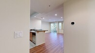 Located at 8714 Glenoaks Blvd in Los Angeles, CA, this single-floor residence offers 2 bedrooms and 4 bathrooms within a thoughtfully arranged layout. The living room serves as a welcoming central space, featuring warm hardwood flooring, recessed lighting, a classic fireplace, and large windows with vertical blinds that allow generous natural light and views of surrounding greenery. The kitchen is well-appointed with warm wood cabinetry, dark granite countertops, tile flooring, and a full suite of stainless steel appliances including a gas range, built-in microwave, refrigerator, and dishwasher. The bedrooms offer plush carpeting and windows overlooking lush outdoor foliage, creating a calm and comfortable atmosphere. The four bathrooms vary in configuration — one features a full tub-shower combo with white tile surround and a wood-tone vanity, another includes a soaking tub, and a powder room provides a compact pedestal sink with a round mirror. Clean, neutral wall tones are consistent throughout the home, contributing to a bright and cohesive aesthetic. The overall design emphasizes functionality and comfort within an efficiently utilized floor plan.