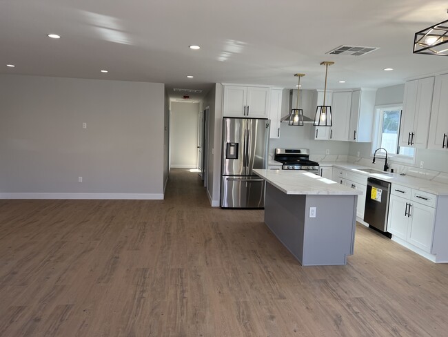 Kitchen with large island - 8458 Darby Ave
