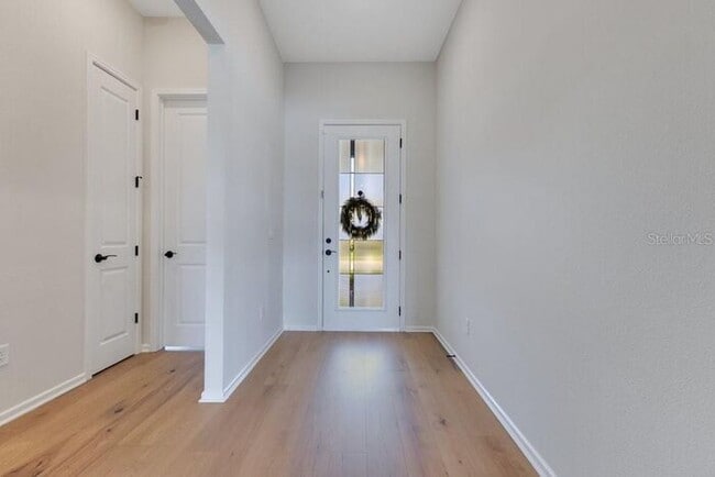 Photo - Waterfront Luxury in Isles of Lake Nona | 3-Car Garage, Resort Amenities & HOA-Included Cable, In... House