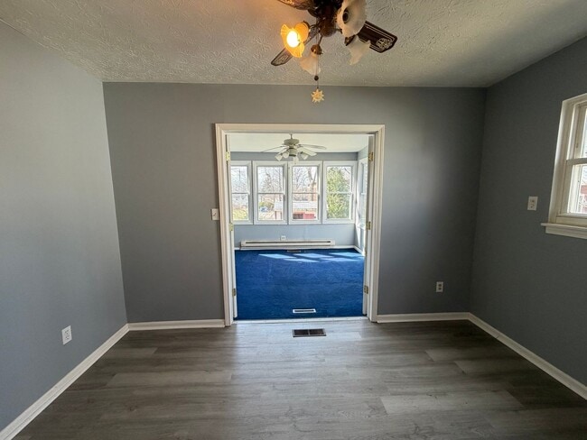 Building Photo - Bright Cape w/ Sunroom, Central Air, Big Basement & Backyard Shed