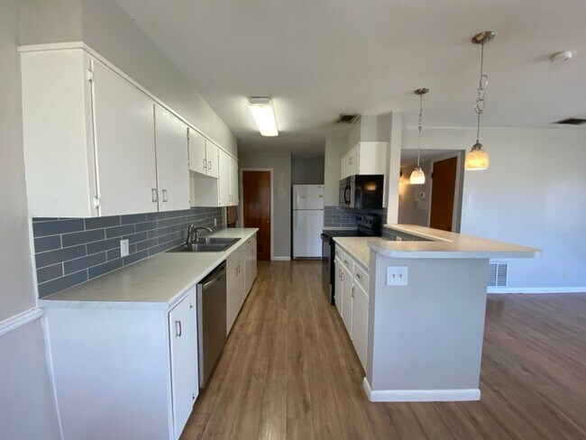 Building Photo - Three bedroom home available!
