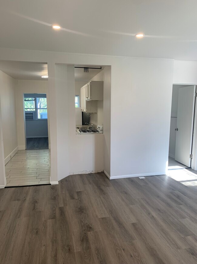 Living Room looking towards galley kitchen and bathroom - 1620 S 1000 E