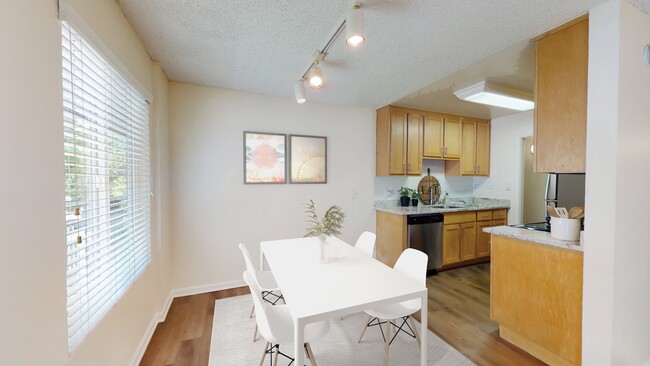 Dining area and kitchen at Pleasanton Glen Apartment Homes - Pleasanton Glen Apartments