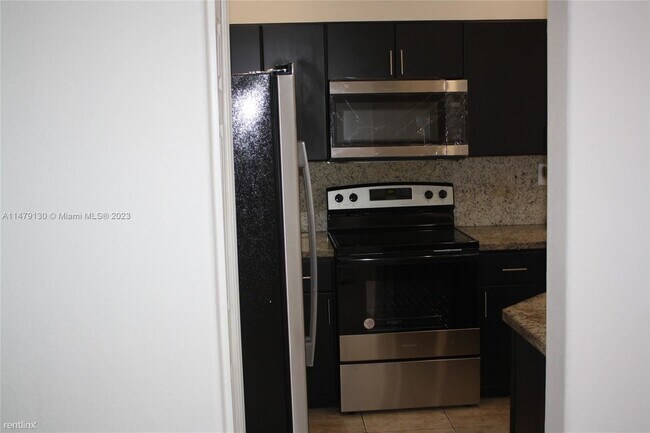 Building Photo - 3 br, 2.5 bath House - 7637 NW 116th Ave