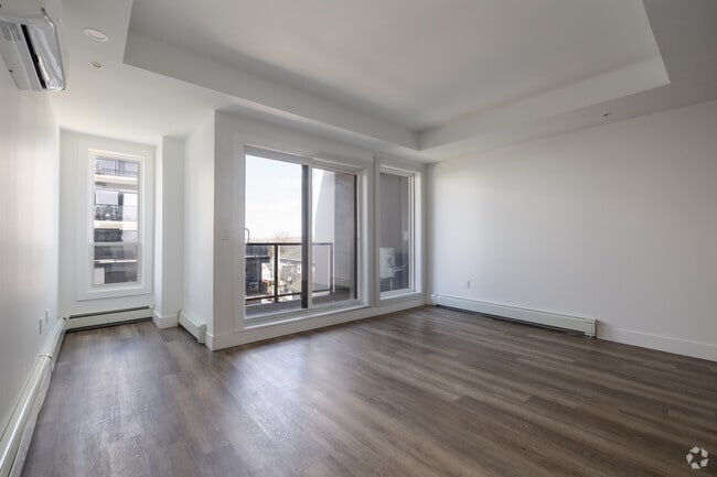 3BR, 2BA - 1483 SF - Living Room - Courtyard 1 & 2 At Bayers & Young