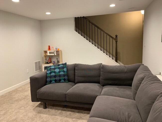 Basement living room - 15521 E Kenyon Ave