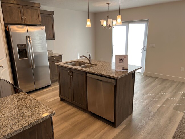 Building Photo - 3 bed | 2.5 bath | 2-car Townhome with Was...