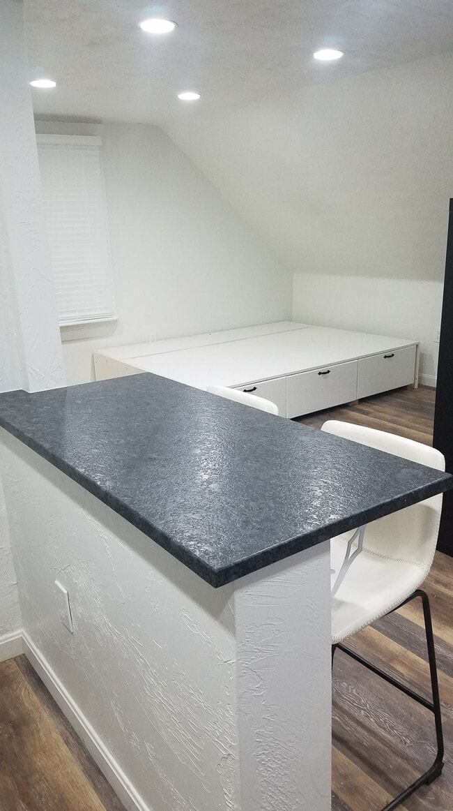 Granite Counter and Bar Stools - 1048 Logan Rd