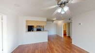 This 880 square foot apartment offers a well-designed layout with 2 bedrooms and 1 bathroom. The open-concept living area seamlessly connects to the kitchen, creating a spacious feel. The updated kitchen features wooden cabinetry, a tile backsplash, and black appliances, including a refrigerator and stove.

Both bedrooms are carpeted and include closet space with built-in shelving. The primary bedroom, measuring 180 square feet, provides ample room for a comfortable retreat. The bathroom showcases a vanity with wooden cabinets, a large mirror, and a shower/tub combination.

The apartment boasts wood-look flooring in the main living areas and kitchen, enhancing its modern appeal. Ceiling fans in multiple rooms offer improved air circulation and comfort. Large windows allow natural light to flood the space, creating a bright and airy ambiance.

A notable feature is the in-unit laundry room, equipped with a washer and dryer for added convenience. The apartment also includes additional storage solutions, such as closets and built-in shelving units.

Located in the Lakewood Place complex, this unit combines functionality with comfort, making it an ideal living space for those seeking a well-appointed apartment in a convenient location.