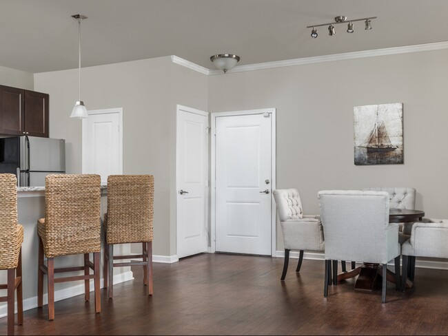 Open Dining Room with Hardwood Style Flooring - Talison Row at Daniel Island Apartments