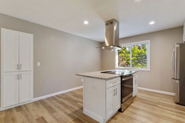 Island with glass vent hood - 4705 Golden Valley Rd