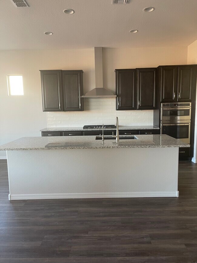 granite counters - 27414 W Sierra Pinta Dr