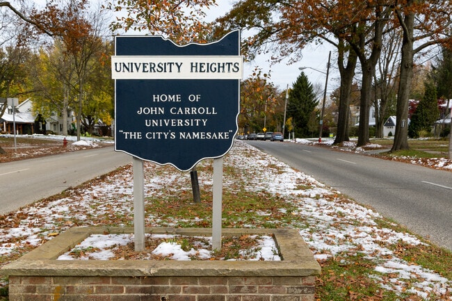 A sign at the entrance of University Heights welcomes residents.