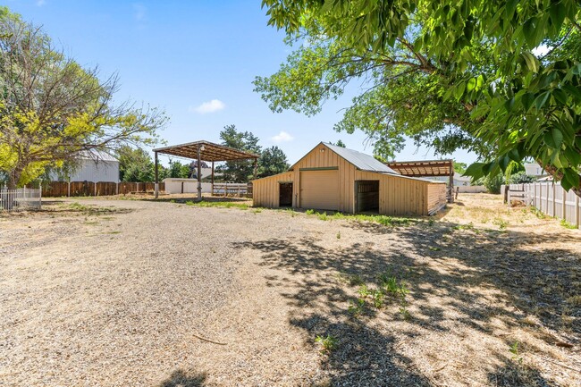 Building Photo - ACREAGE IN TOWN!  Covered RV Parking & Roo...