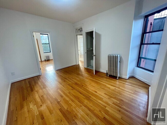 Building Photo - SUNNY 3 BEDROOM ON EAST 7 STREET