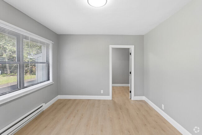 4BR, 1BA - 1,200 SF - Living Room - Hymann Heights Apartments