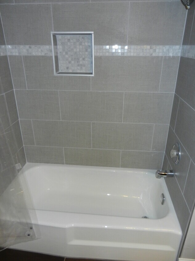 New tile around the tub.. - 2711 Hobson Road