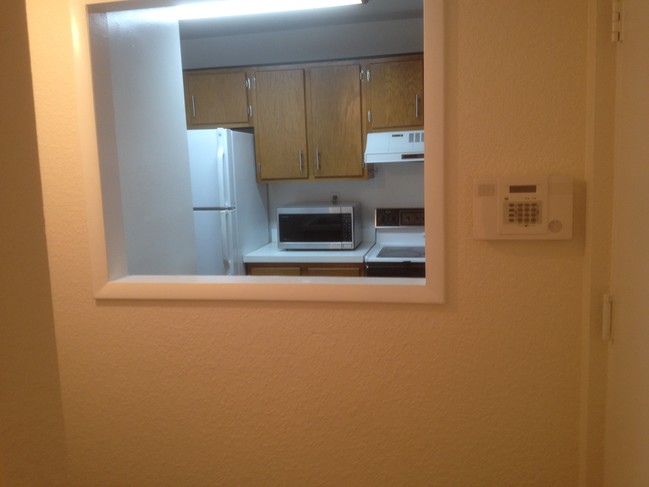 Kitchen window to foyer washer dryer unit - 4145 NW 90th Ave