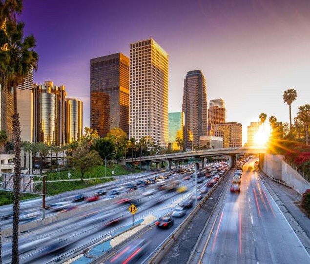 Busy DTLA highway at sunset