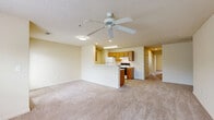 This single-story residence in Foley, Alabama, offers 960 square feet of efficient living space. The home features three bedrooms, including a primary bedroom of 150 square feet, and two full bathrooms. The layout is designed for modern living, with an open-concept area combining the kitchen and living room. The kitchen is equipped with essential appliances, wood cabinetry, and a practical galley-style layout. Bathrooms showcase clean lines with wood vanities and simple fixtures. Throughout the home, neutral-toned walls and carpeting create a blank canvas for personalization. Large windows in the bedrooms and living areas allow for abundant natural light, enhancing the sense of space. The property includes closet space, with two dedicated closet areas for storage. Ceiling fans in some rooms provide additional comfort. The overall design prioritizes functionality and simplicity, making it an ideal starter home or investment property in a residential neighborhood.