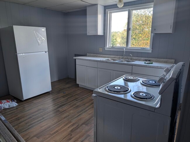 Updated kitchen with new appliances - 302 Jerome Ave