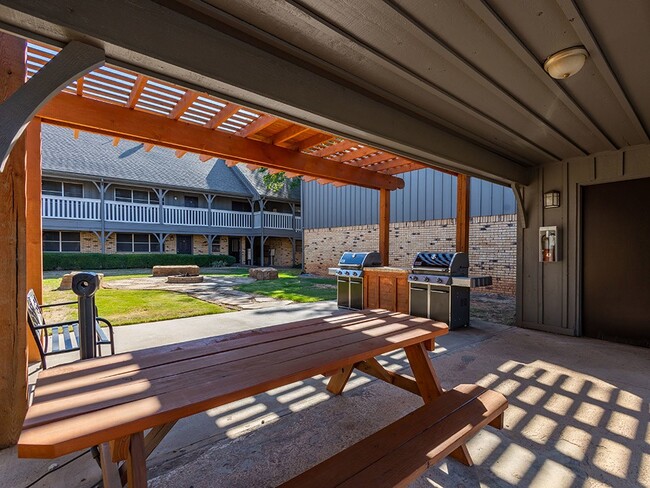 Outdoor Grilling Area - Camelot Apartments in Wichita Falls TX