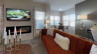 Located at Watermark Blvd in Oklahoma City, OK, this single-floor residence offers a thoughtfully designed layout that balances modern finishes with comfortable living. The kitchen is a standout feature, showcasing rich dark cabinetry, marble-style countertops, a classic subway tile backsplash, and a full suite of stainless steel appliances. A peninsula with bar seating provides a practical and stylish space for casual dining or entertaining.

The open-concept living and dining area is bright and welcoming, with multiple windows that allow generous natural light to fill the space. A wall-mounted electric fireplace adds warmth and a contemporary focal point to the living room, which flows seamlessly into the dining area.

The bedrooms are carpeted and serene, offering comfortable retreats with ample natural light from well-positioned windows. The bathrooms continue the design language of the kitchen, featuring dark vanity cabinetry, marble-style countertops, and tile flooring that lends a clean, polished look.

Throughout the residence, neutral wall tones and light flooring create a cohesive and versatile aesthetic, making each room feel open and inviting. The overall design reflects a consistent commitment to modern, functional finishes across every area of the home.