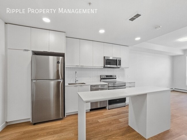 Building Photo - MODERN 1-BED CONDO | BELVEDERE PREMIER LIVING | SLEEK FINISHES