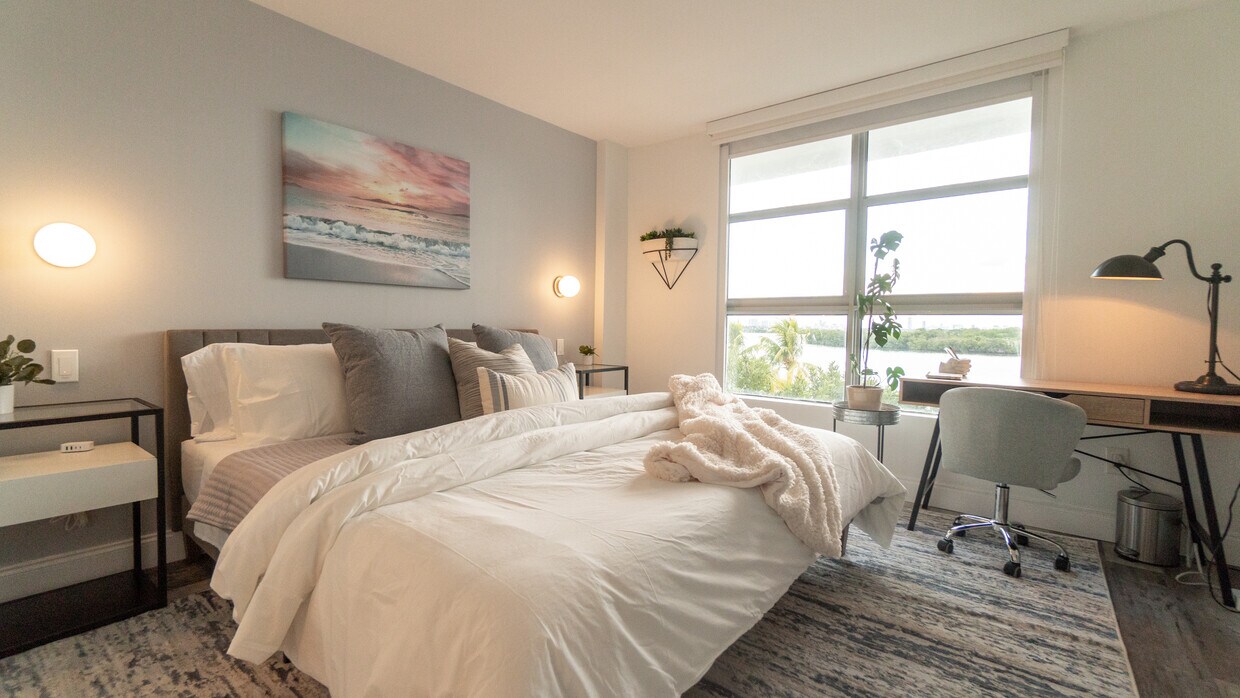 Master bedroom with king bed and bay views - 750 NE 64th St