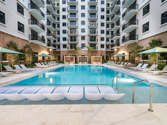 Soak up the sun without ever leaving the pool. - Modera Academical Village Apartments