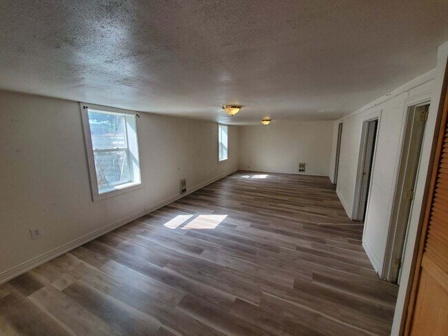 Living room with large daylight windows - 222 S 6th Ave