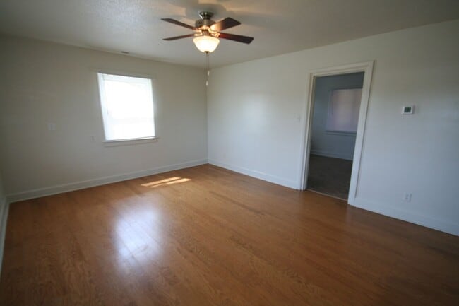 Photo - Two bedrooms, hardwood throughout, and a private driveway — all under $1,400 near Duke West. Apartment